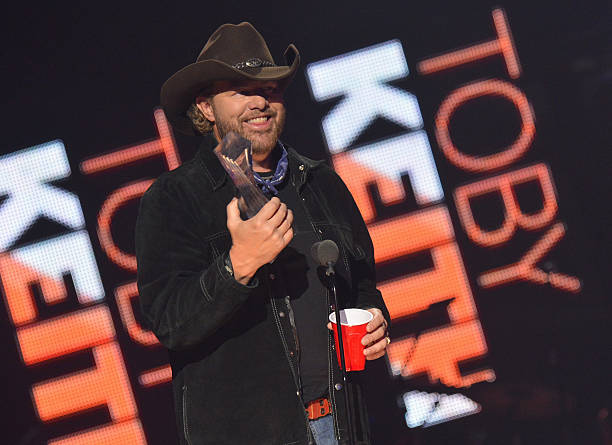 Toby Keith accepts award onstage during the 2012 CMT Artists Of The Year at The Factory at Franklin on December 3, 2012 in Franklin, Tennessee.