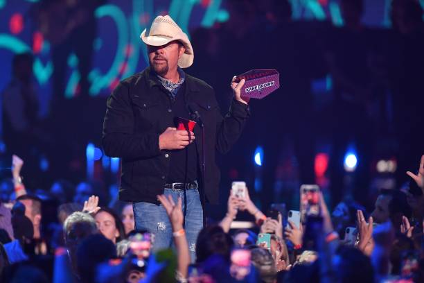 Toby Keith speaks on stage during 2019 CMT Music Awards Show at Bridgestone Arena on June 5, 2019 in Nashville, Tennessee.
